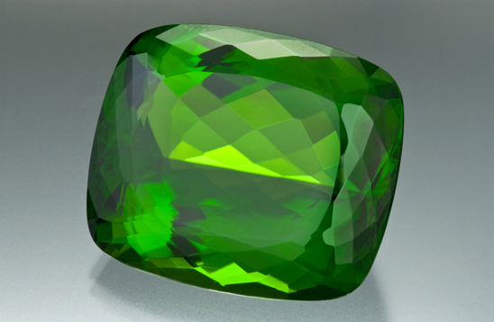 Photographed from the GIA Collection for the CIBJO project from the Dr. Eduard J. Gubelin Collection. Collection # 30880, antique cushion cut peridot, 130.60 ct.